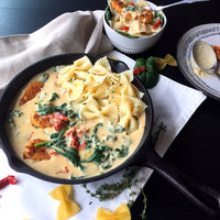 Creamy Tuscan Chick'un: Gourmet pasta dish that's perfect for holidays, special occasion or just a weeknight dinner. Cooked golden, crisp chicken-less bites served in a delicate, creamy garlic sauce with spinach and sun dried tomatoes over tender pasta. A perfect home cooked meal full of flavor ready to serve in under 30min.