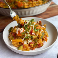 Spanish Vegetable Risotto: Healthy, beautiful rice dish from the coast of Mediterranean Sea loaded with fiber and protein. Creamy Arborio rice, green beans, onion, garlic, carrots, zucchini, and tomatoes simmered in a savory vegetable broth makes a simple colorful delicious one pot meal.