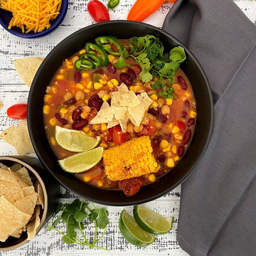 Tortilla Soup:Simple, hearty from south of the border vegetable soup explodes with healthy flavor. Tomatoes, corn, onions, peppers, and beans simmered in vegetable broth with Southwestern spices, topped with tortilla chips is the ultimate bowl of comfort food.
